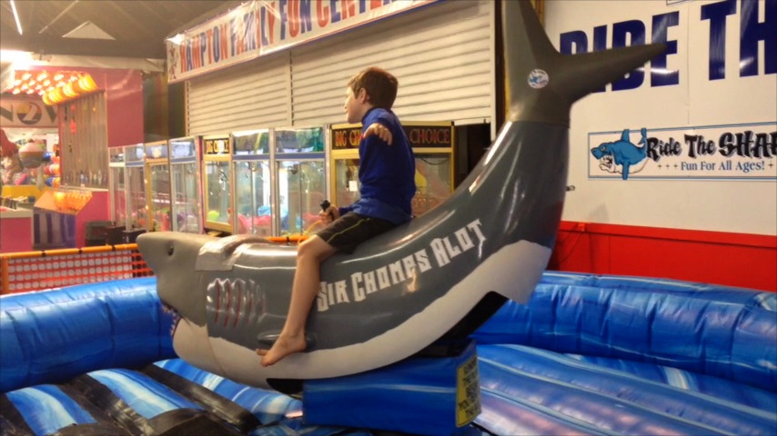 Sir Chomps Alot: Timmy rides the bucking shark at Hampton Beach