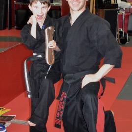 A black belt and his sensei