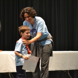 Teddy gets a medal for running over 100 miles!