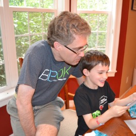 Reading the card from Mommy and Daddy