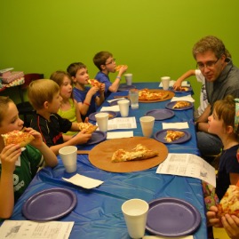 Chomping away on pizza at Loveland Laser Tag