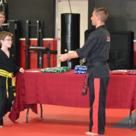 Timmy earns his green belt in TKD