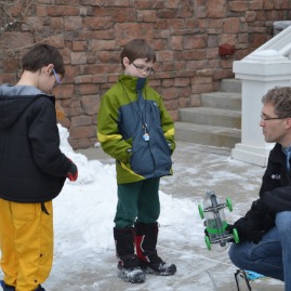 Daddy discusses Timmy and Kaden's science fair project