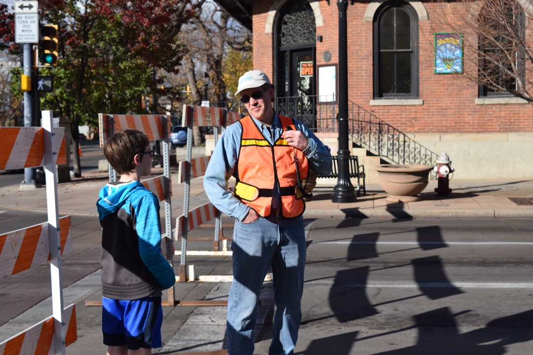Dad helps with communication at the Longmont Halloween Parade
