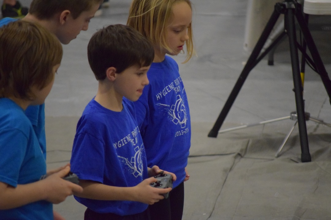 Concentrating on driving his robot