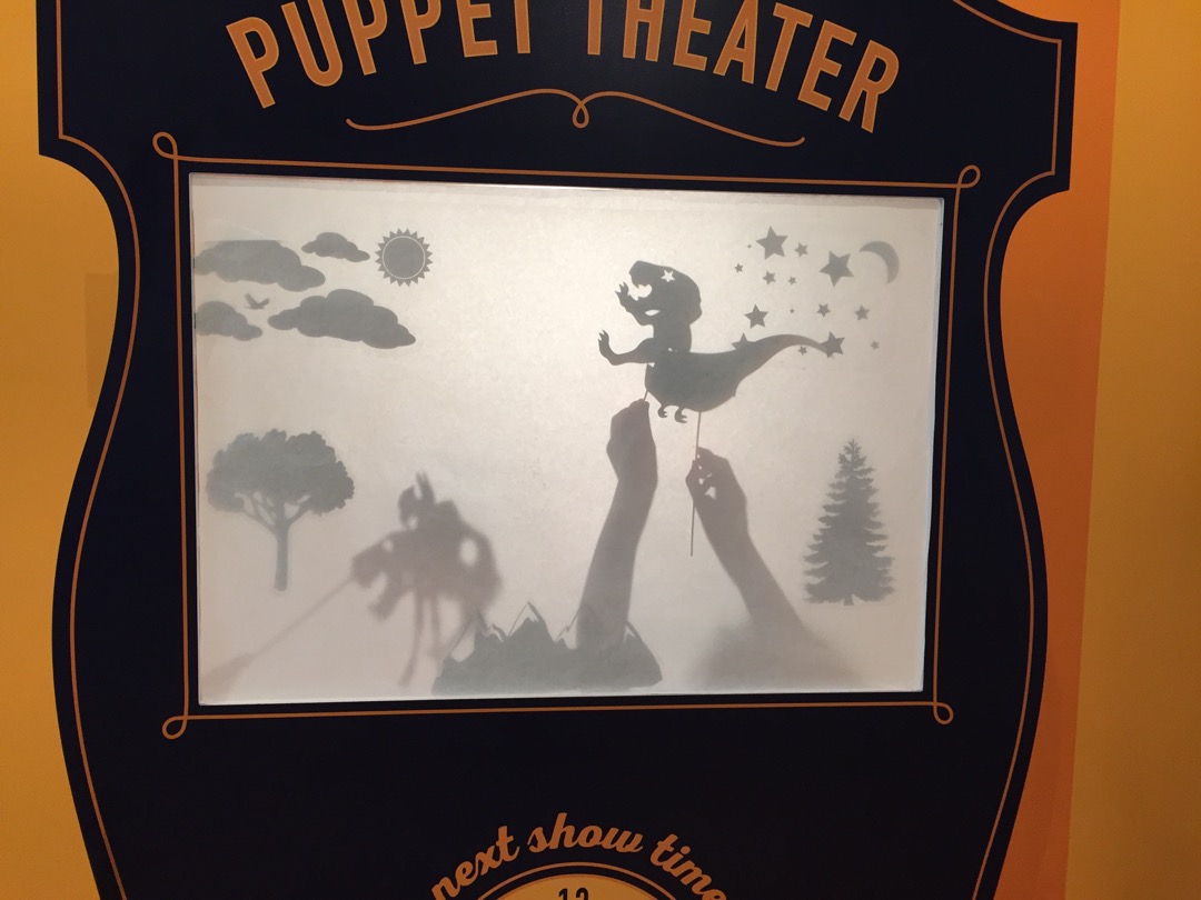 The boys create puppets for a shadow puppet show