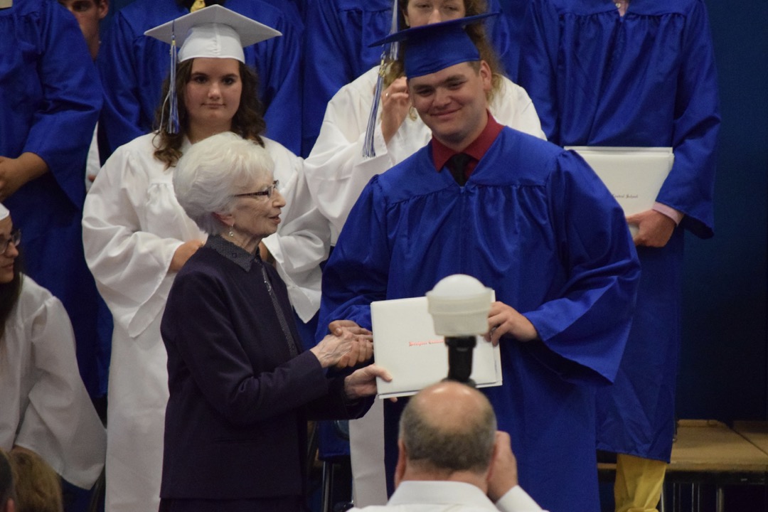 Sam receives his diploma
