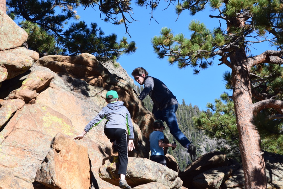 The boys climb the rocks