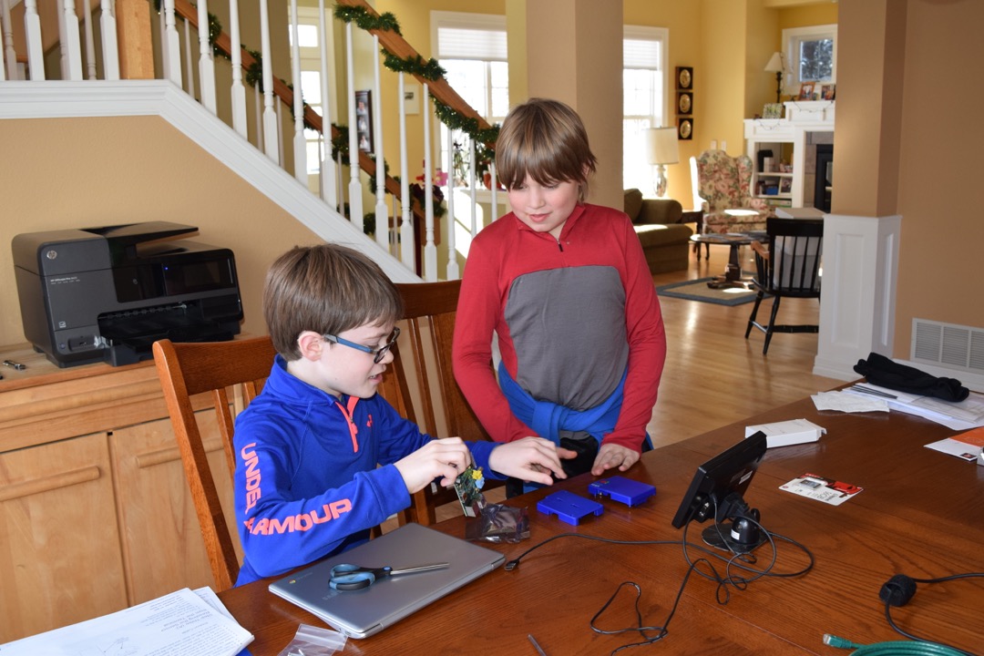 Tim and Hunter work on their science fair project