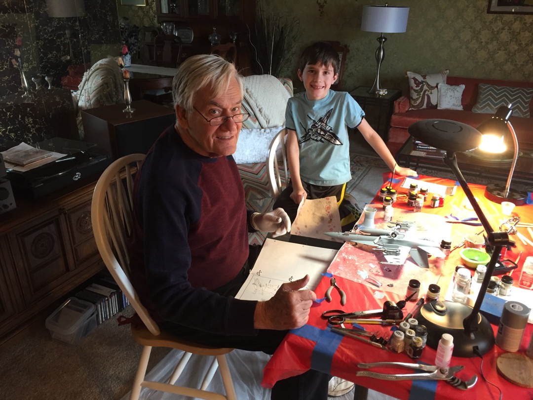 Ted and Grandpa work on a model airplane