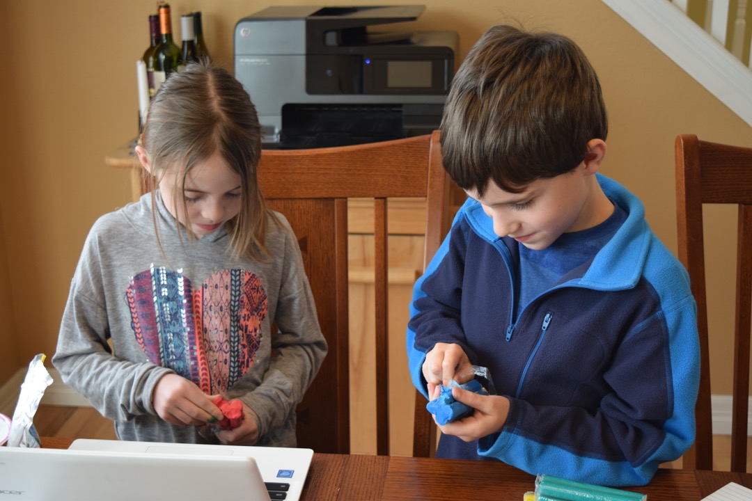 Ted and Caroline work on their science fair project