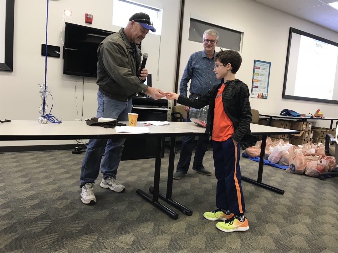 Ted helps with door prizes