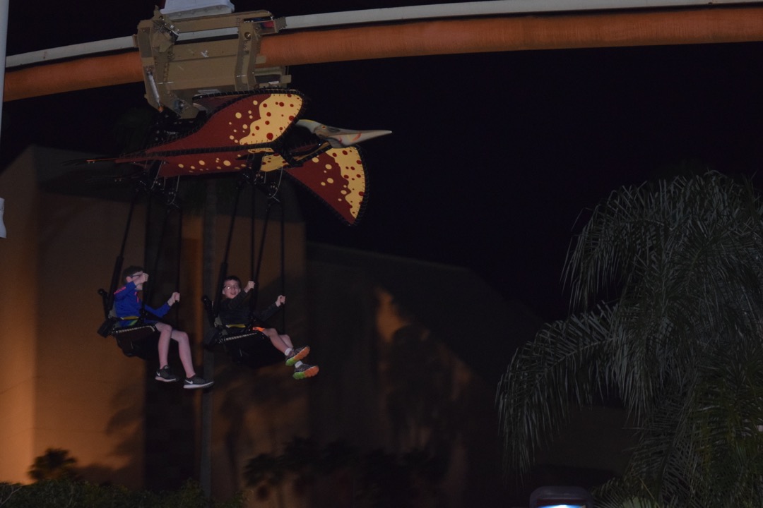 Ted and Tim fly through Jurassic Park at night