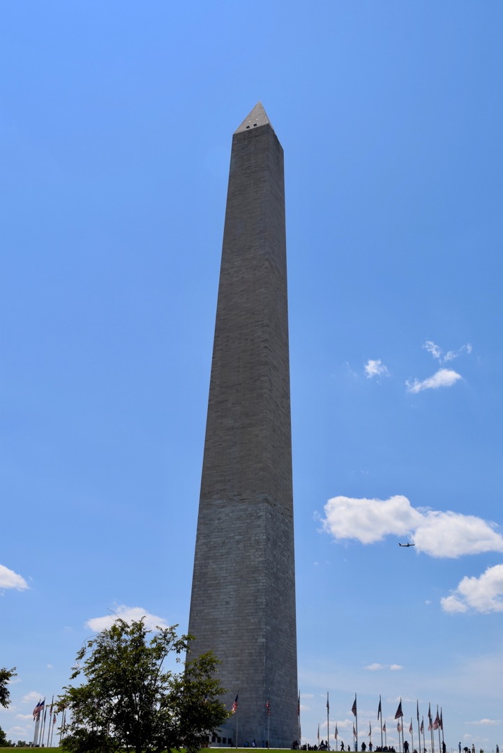 Washington monument with departing flight from DCA