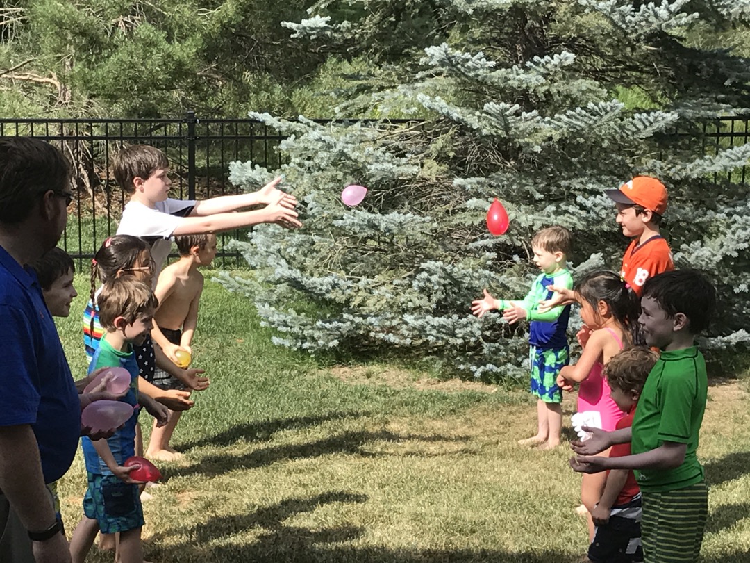 Water balloon toss at a birthday party