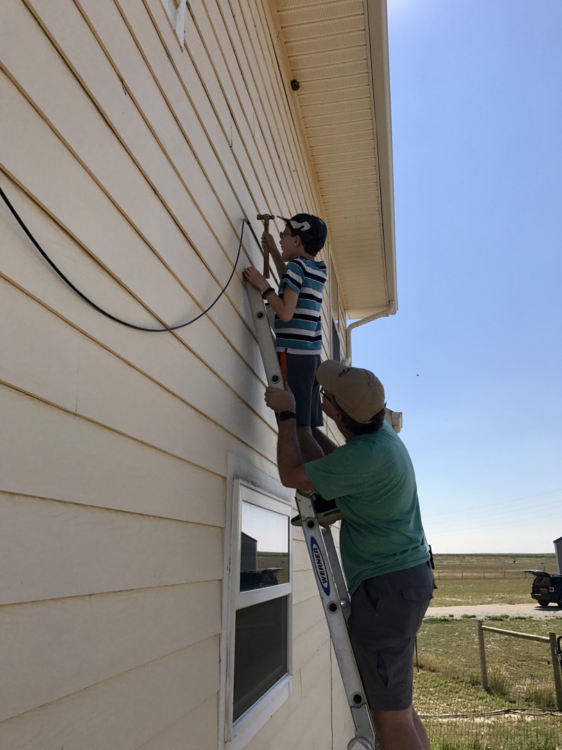 Ted helps install wifi at a friend's house