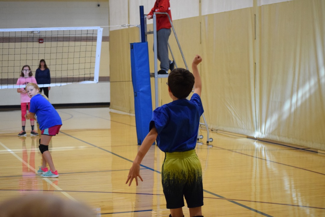 Follow-through on his serve