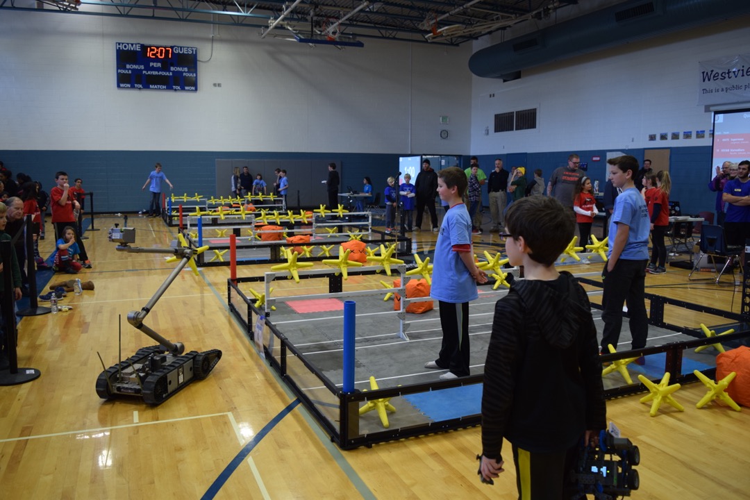 Watching the bomb squad robot entertain the crowd at the middle school tournament