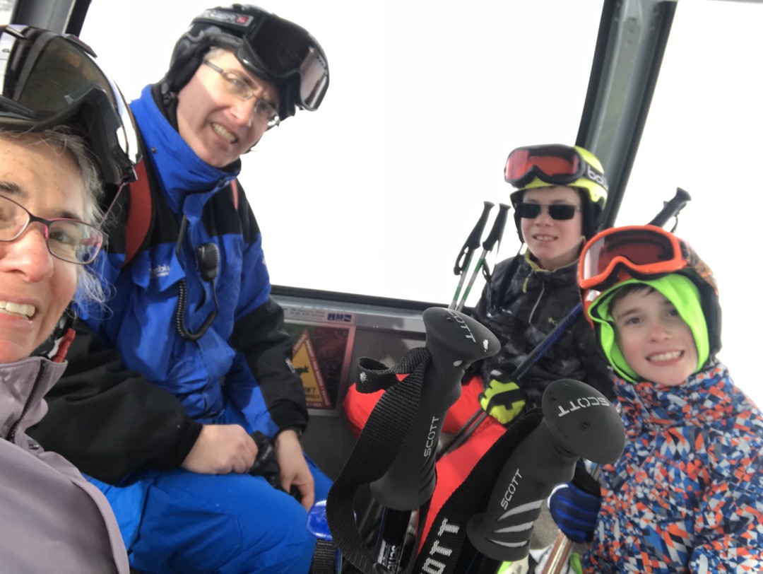 Gondola ride down the mountain after a hard day of skiing