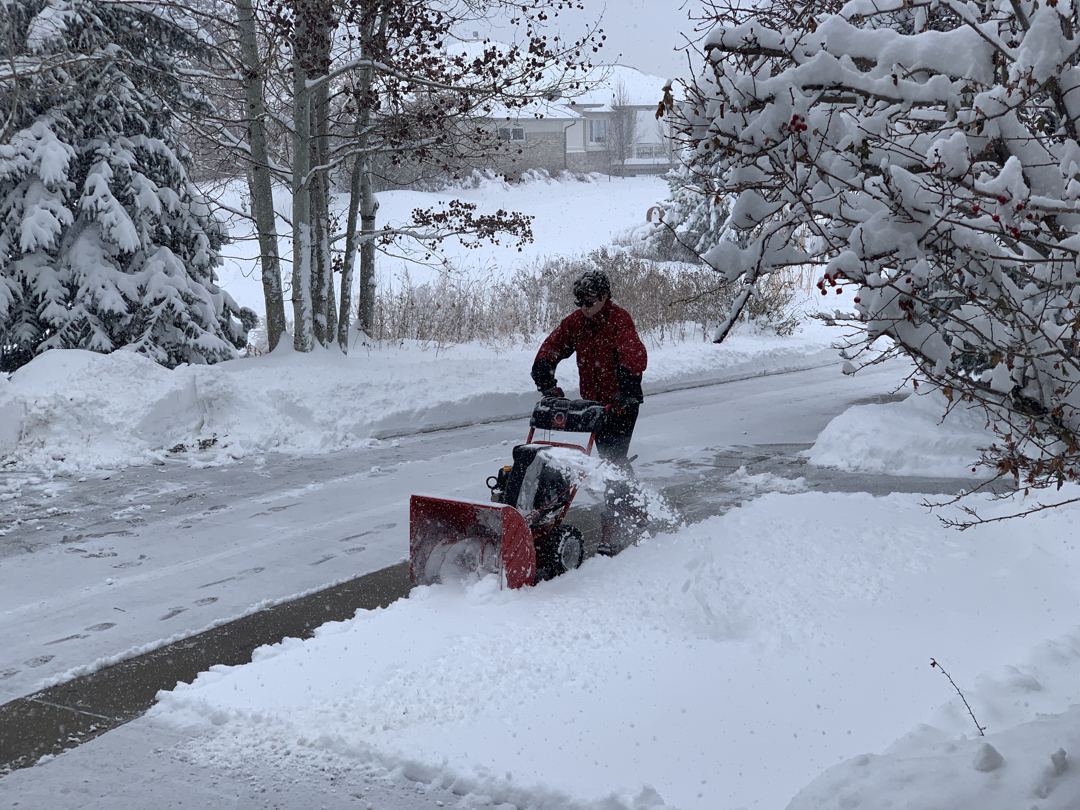 Tim uses the snow blower during the storm