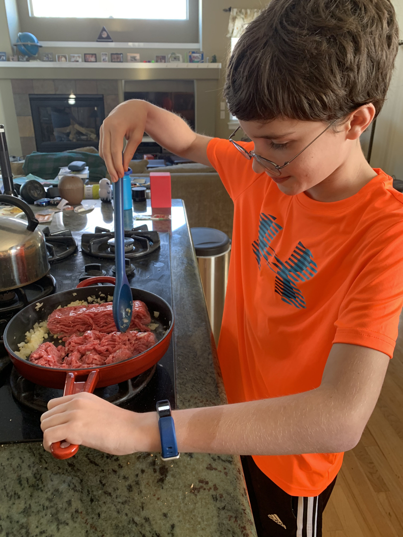 Ted helps make spaghetti sauce