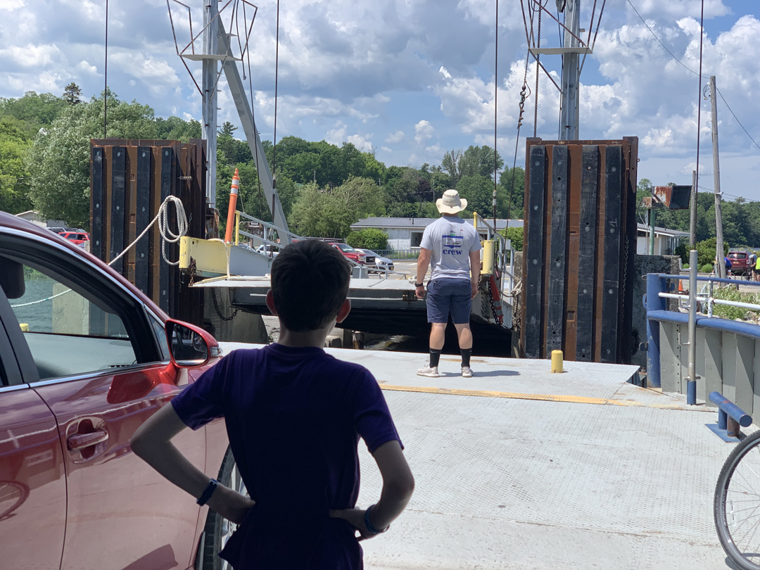 Ted watches the ferry dock