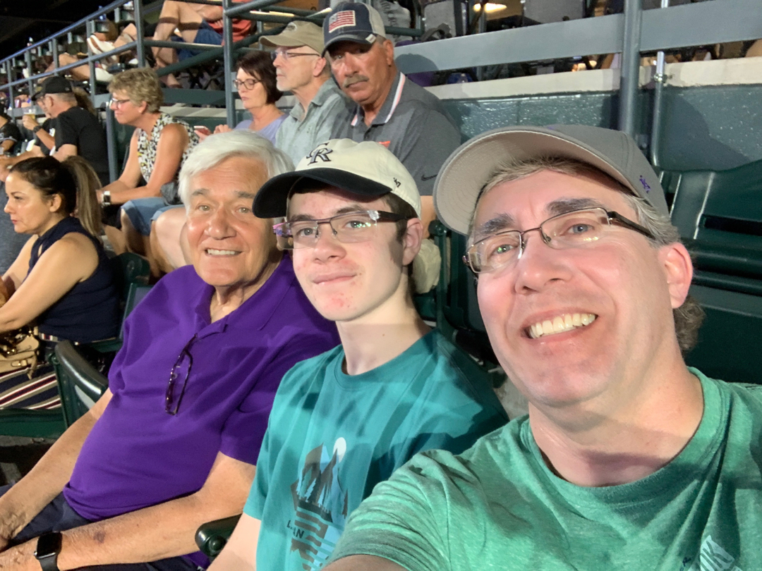 Dad, Tim and Grandpa had fun at a Rockies game