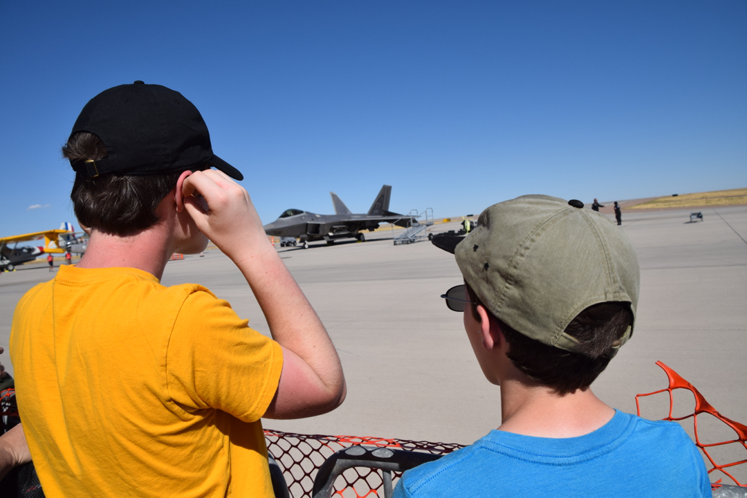 The boys get a closer look as the F-22 taxis