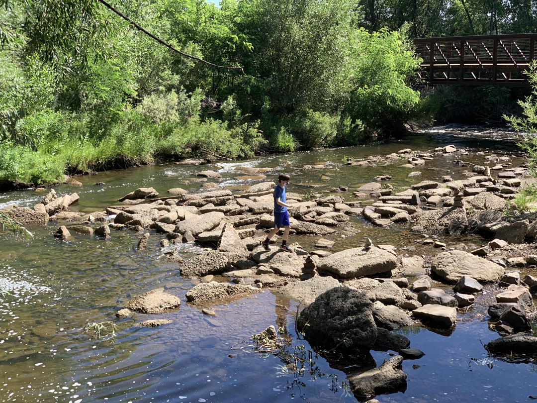 Ted explores the river during our bike ride