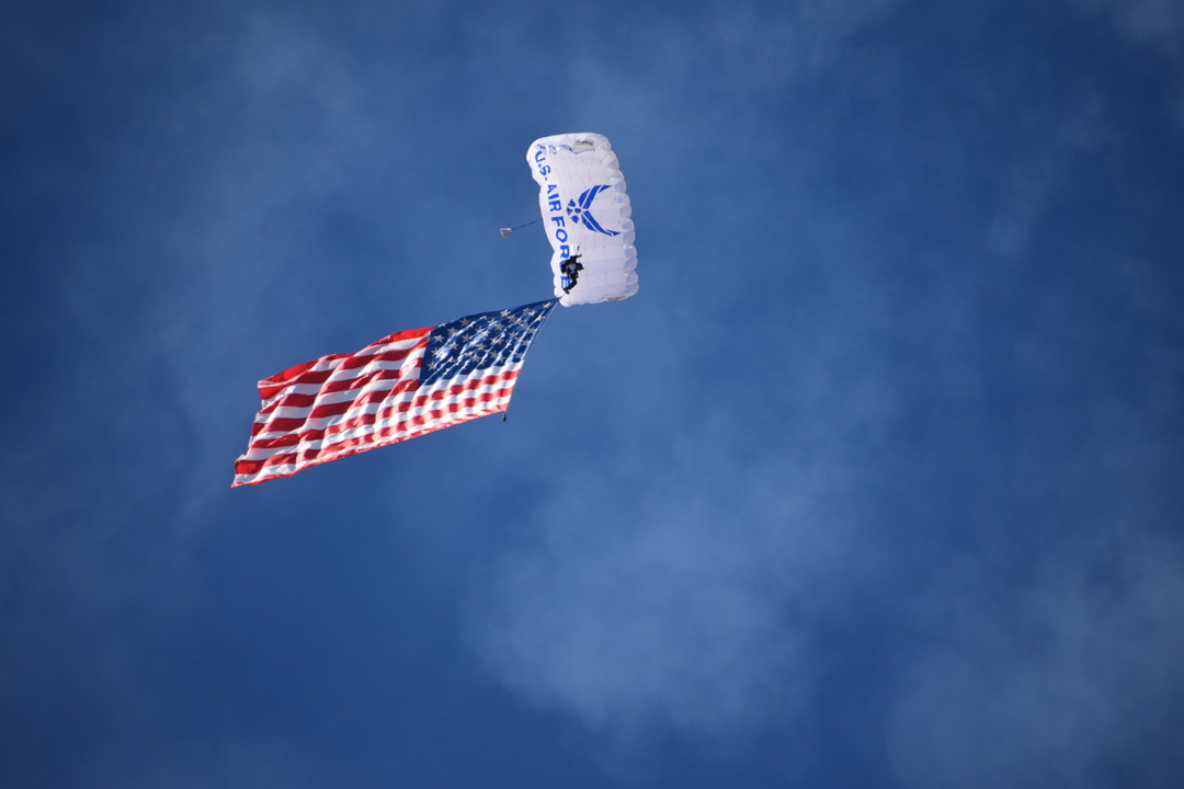 The American flag descends