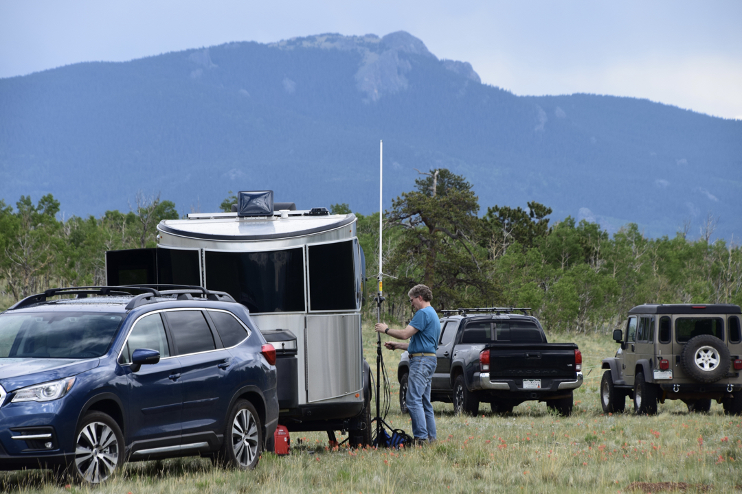 Jeff sets up his ham radio antenna with North Tarryall Peak in the background