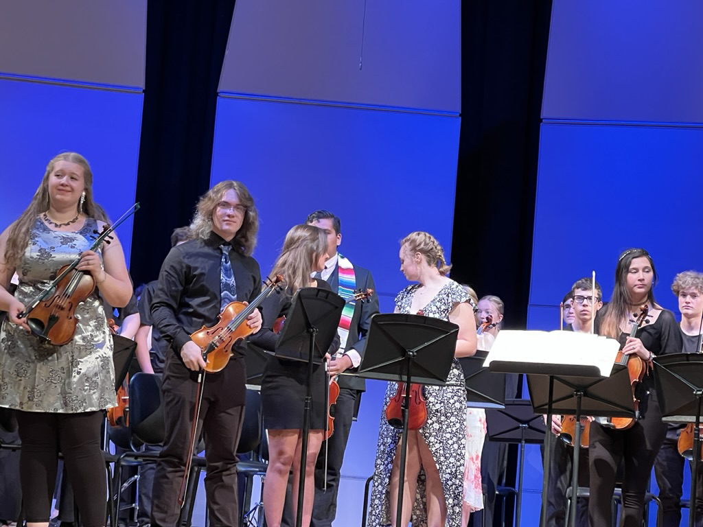 If you look carefully, you can see Ted in the back! The only time they have played together in a concert.