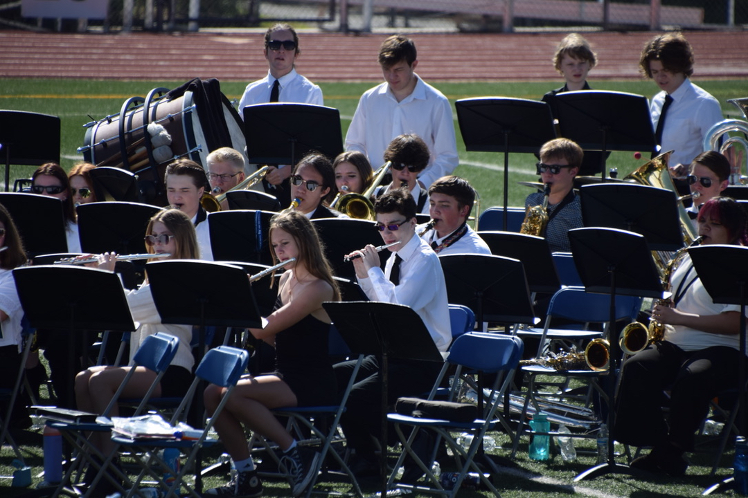 Ted plays in the band for graduation on piccolo