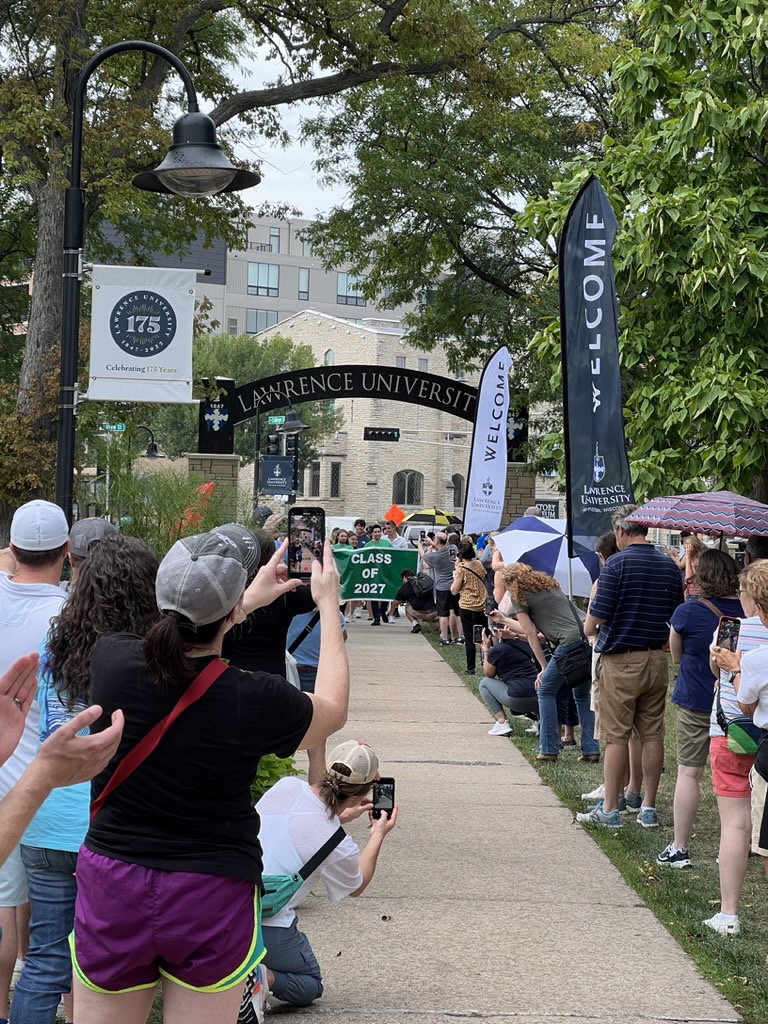 The Class of 2027 parades through the arch