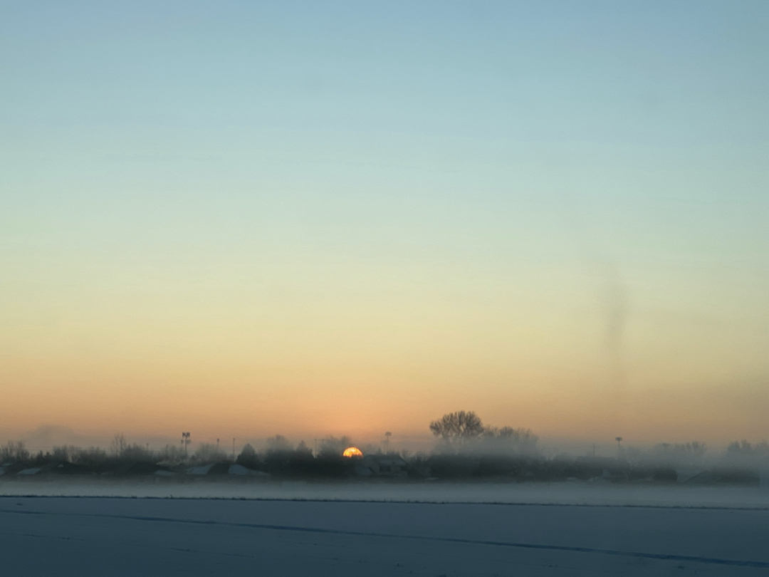 Snowy and  foggy sunrise on the way to work