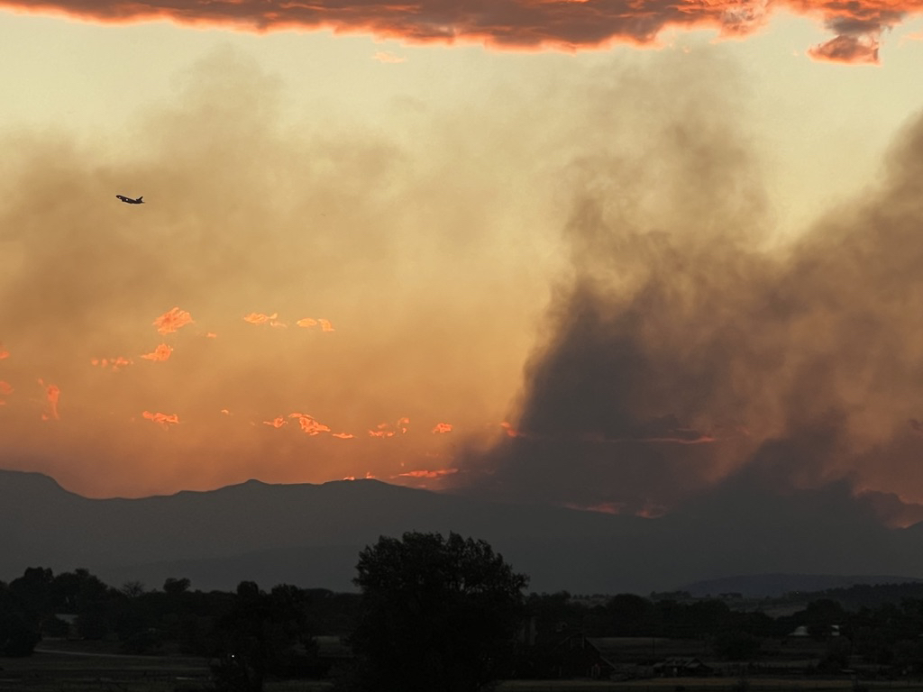 Scene from the end of our street: slurry bomber after a pass at the Stone Canyon fire in Lyons