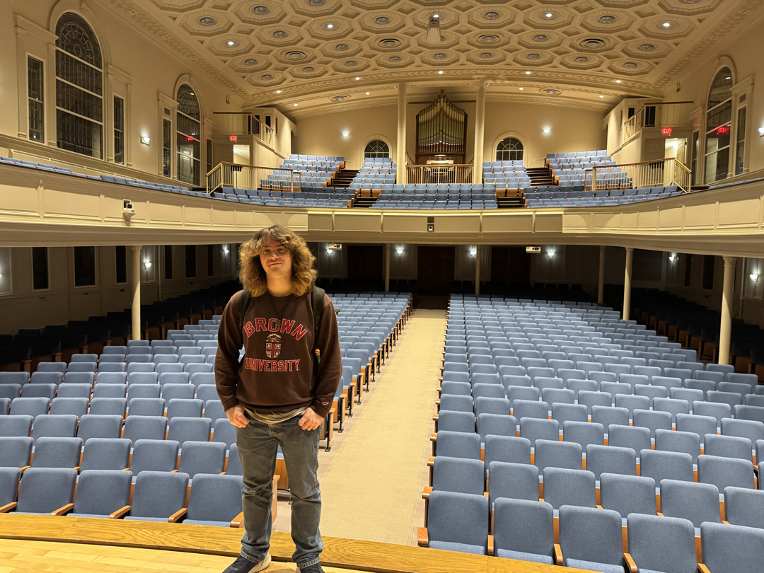 Tim in the Lawrence Chapel with the pipe organ in the background