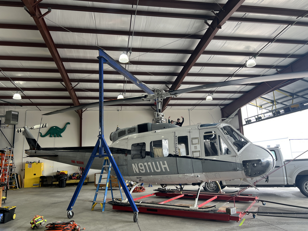 The van parks behind the Huey