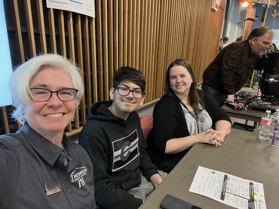 Lisa and co-workers at an 8th grade expo event representing ITS