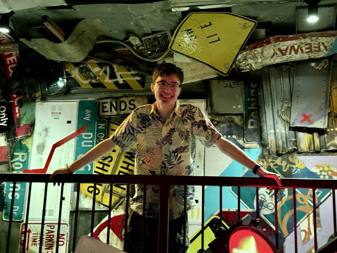 Ted and signs at Meow Wolf