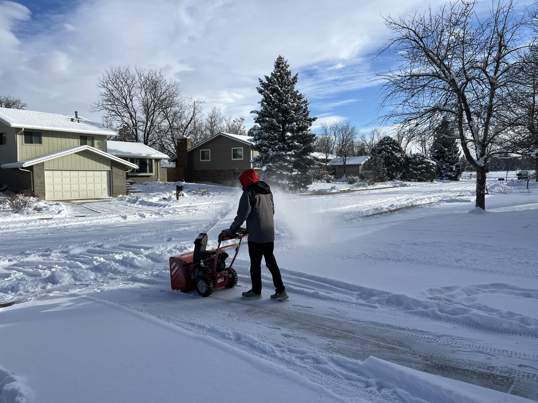 Ted uses the snownblower on Grandpa's driveway